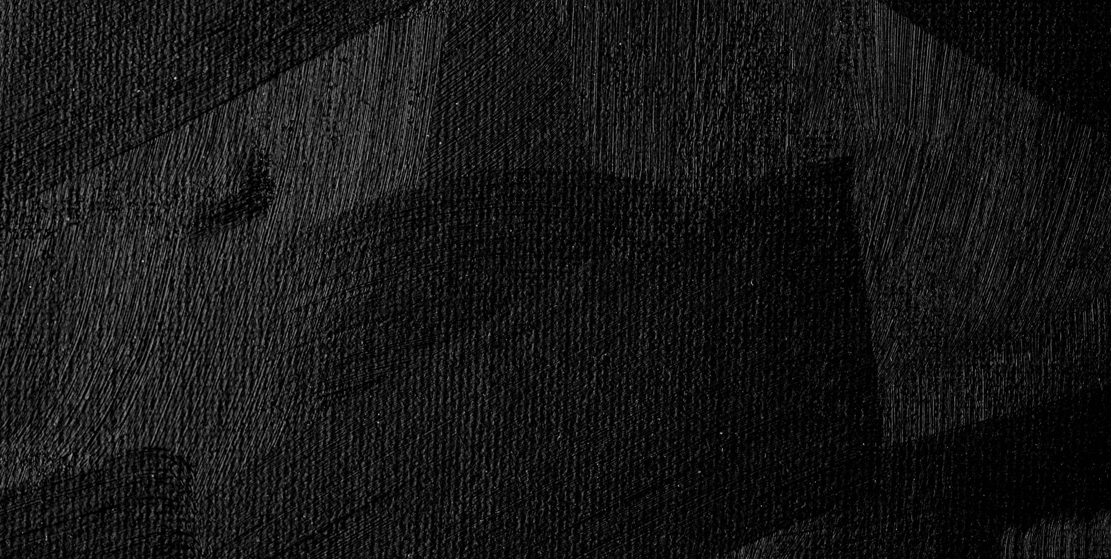 Abstract black textured background with subtle variations.