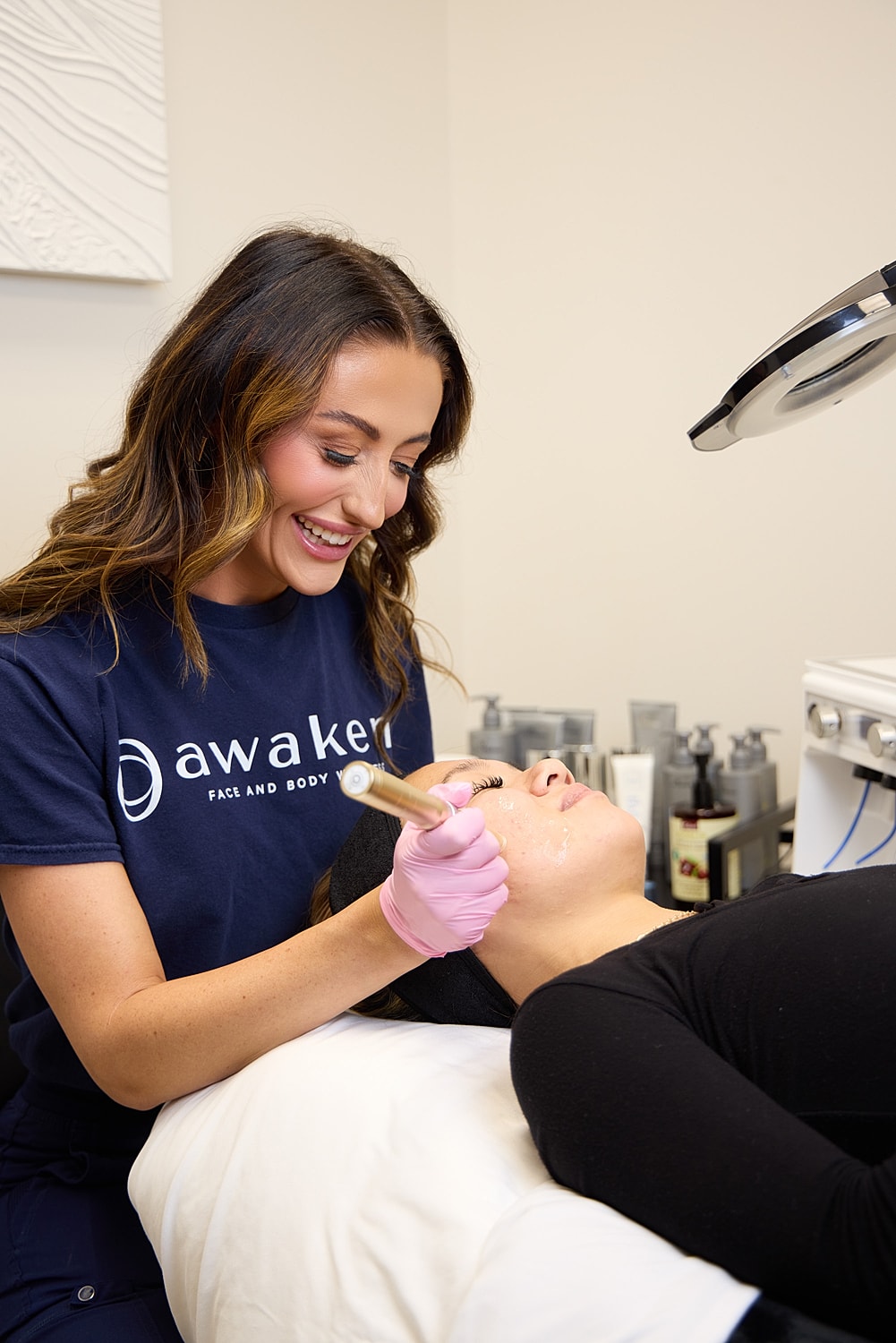 med spa professional performing microneedling on a patient model