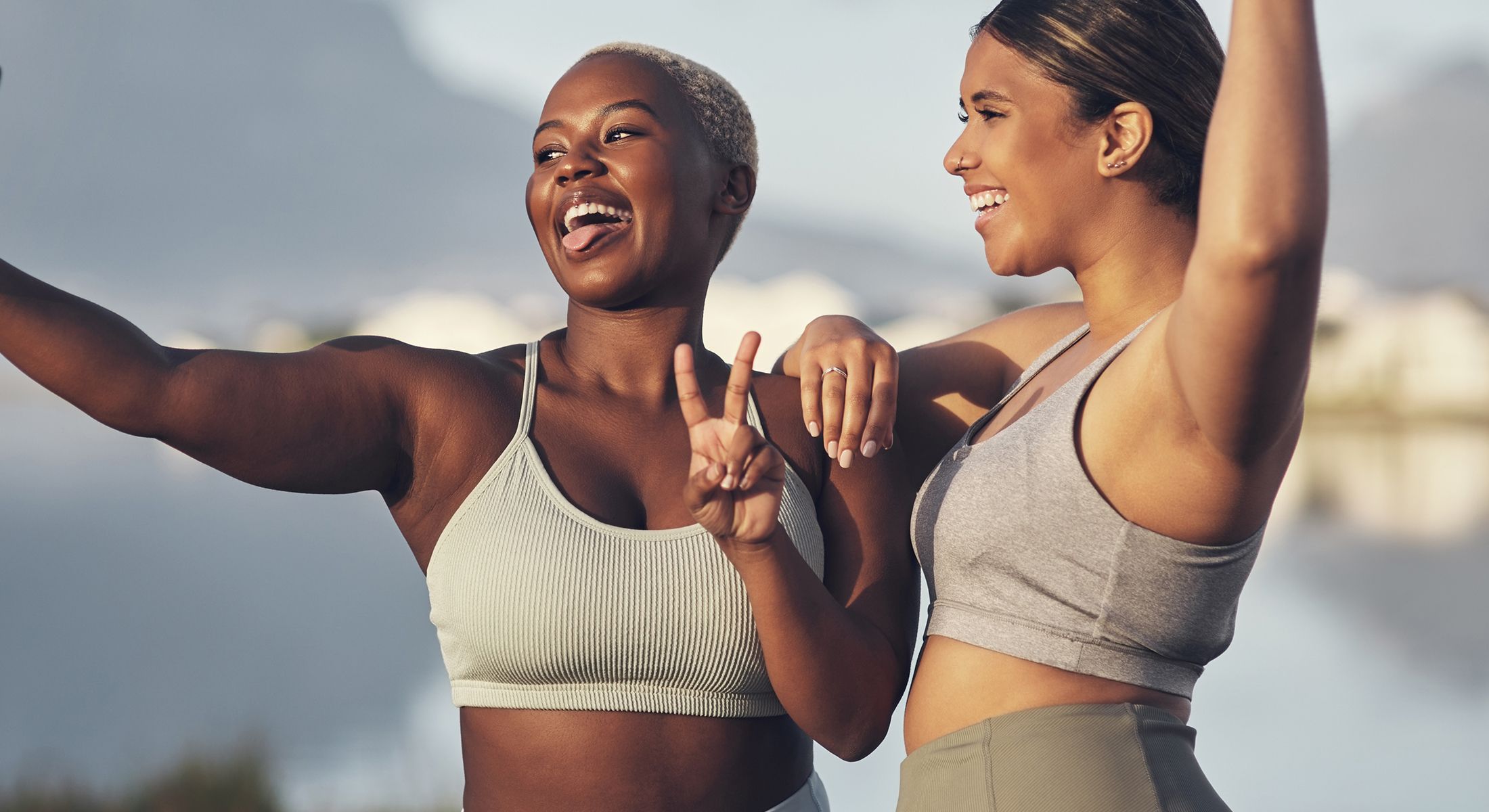 Two semaglutide patient models taking a joyful selfie outdoors.