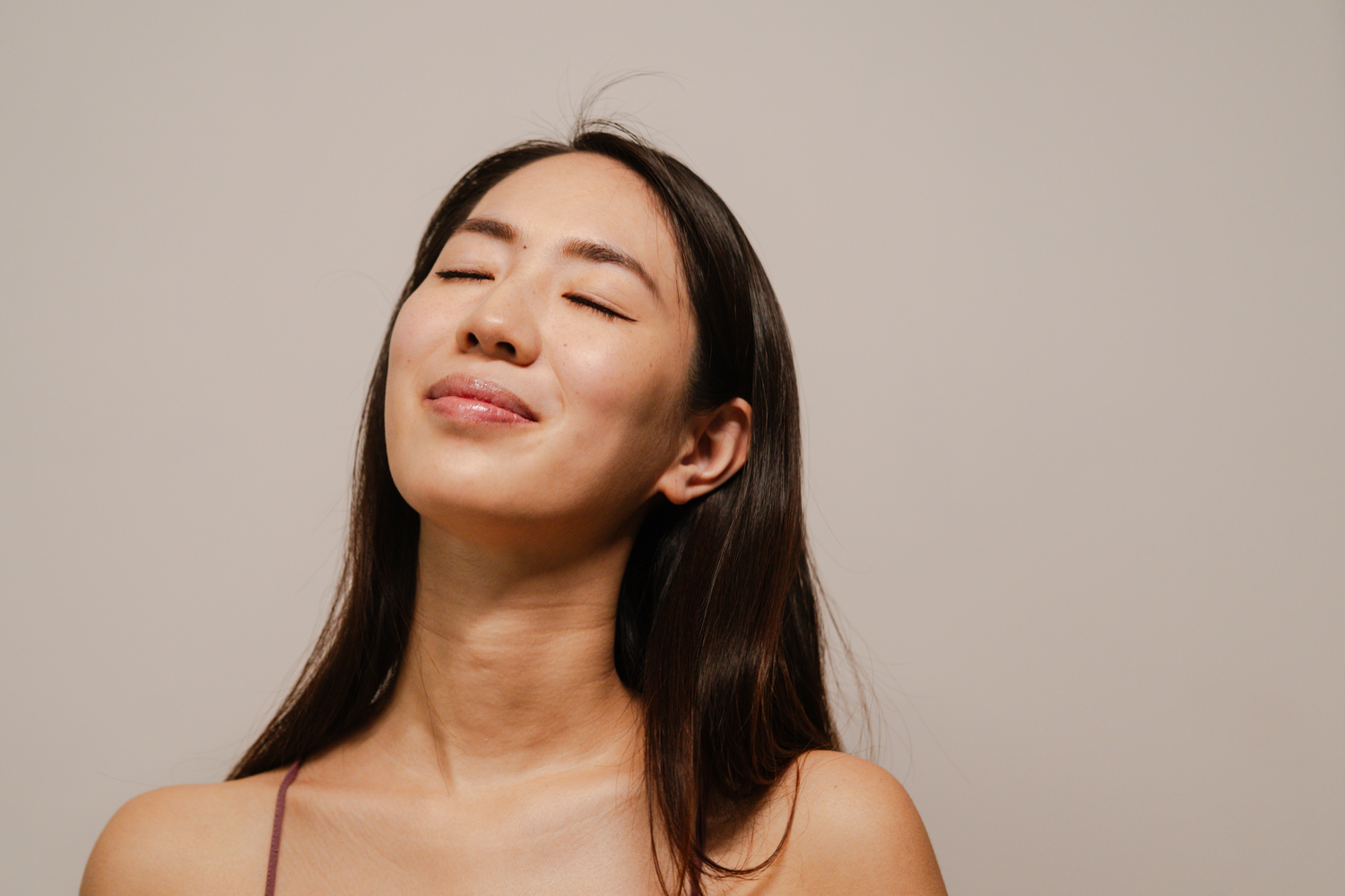 microneedling patient model with closed eyes, serene expression, natural light.